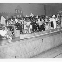 MAF0515_photograph-of-young-students-in-costume-on-stage-at.jpg